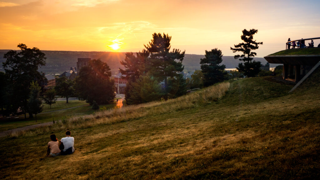 Students watch a sunset from a prime Libe Slope viewing spot