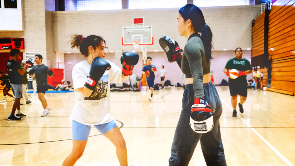 Students participating in an intro to boxing class in Bartels Hall