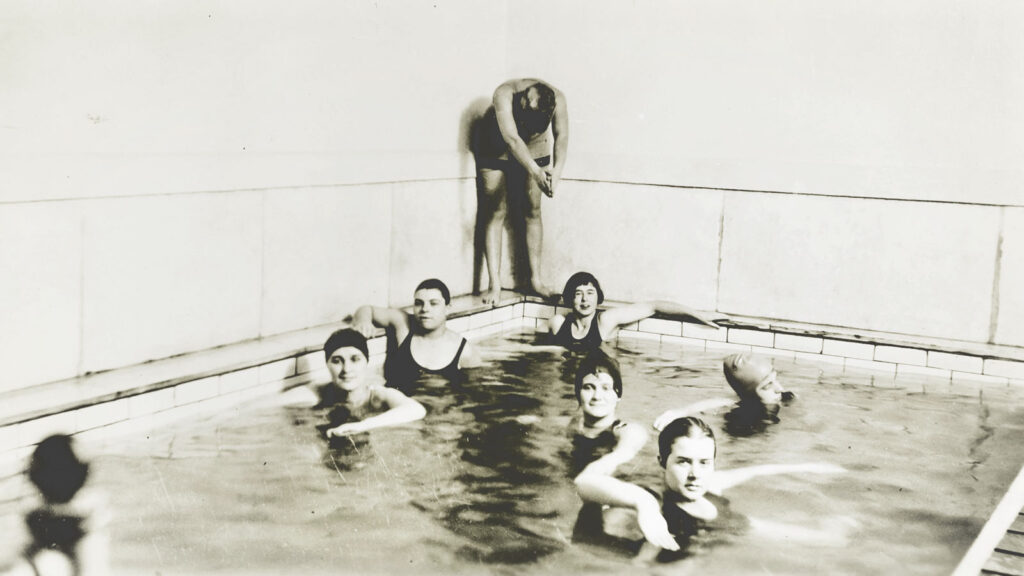 Students in the old Sage Hall pool, circa 1920s