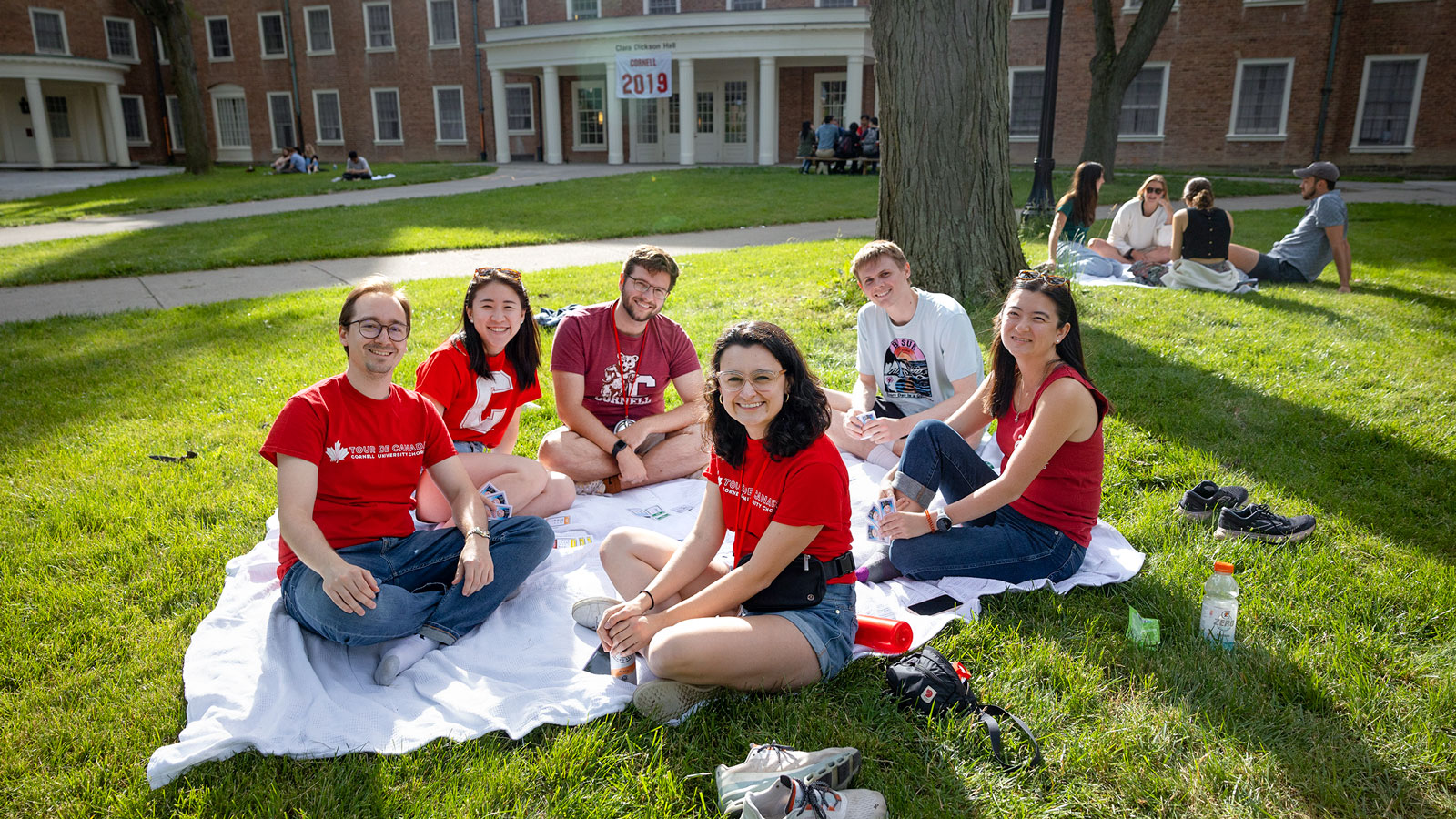 Alumni relax on the lawn in front of Clara Dickson Hall during Reunion 2024