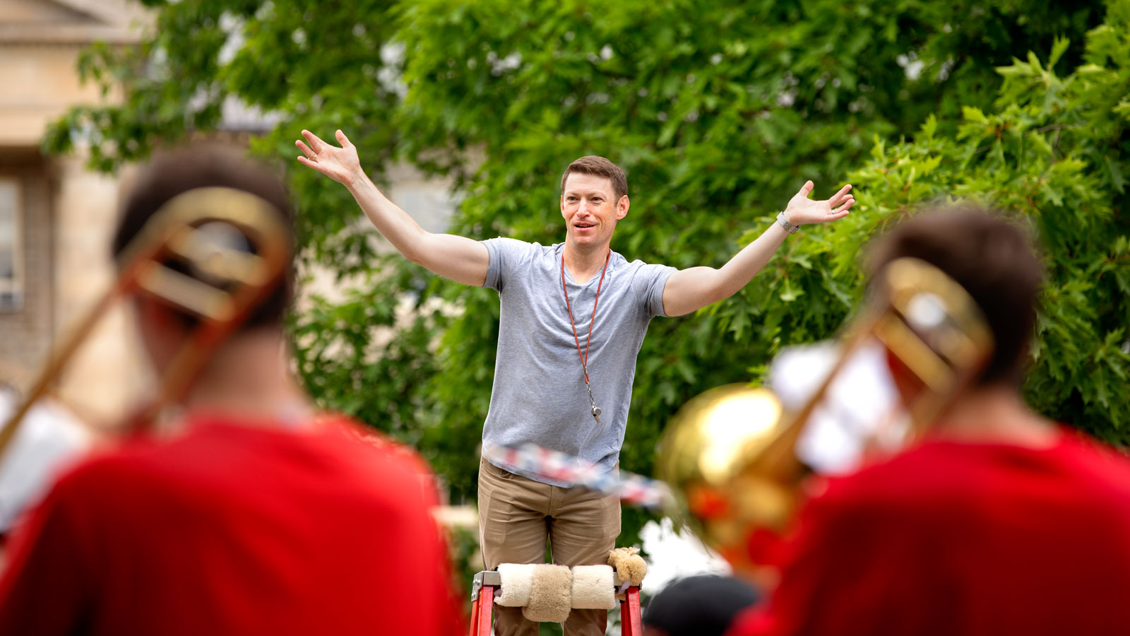 A member of the Cornell Big Red band conducts the band during an Arts Quad performance during Reunion 2024