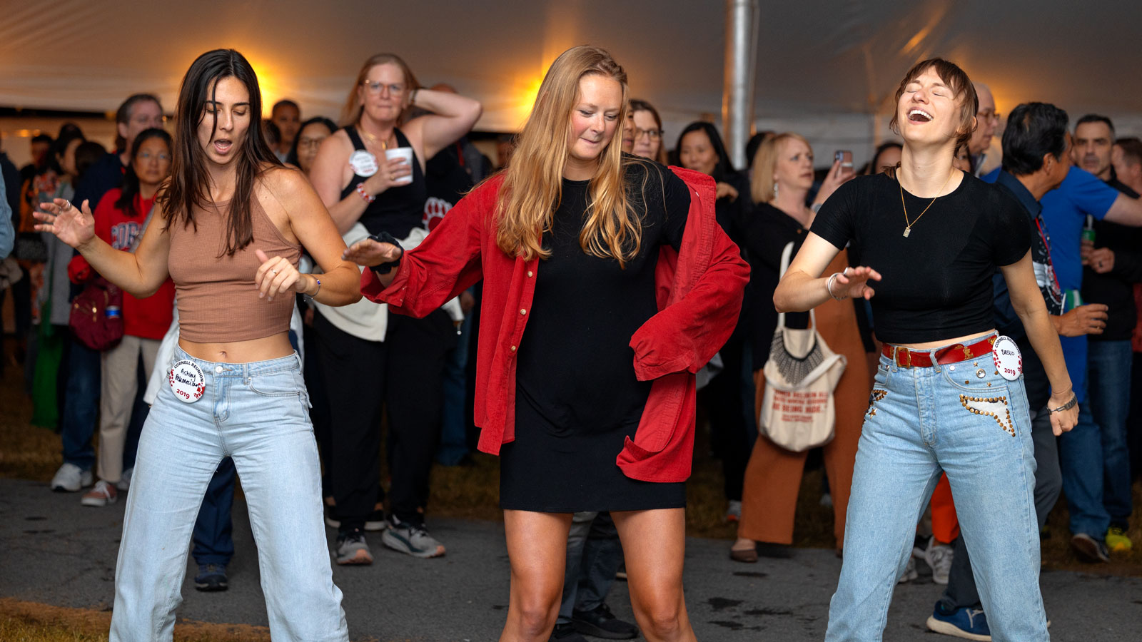 Cornellians dance at the tent parties on the Arts Quad during Reunion 2024