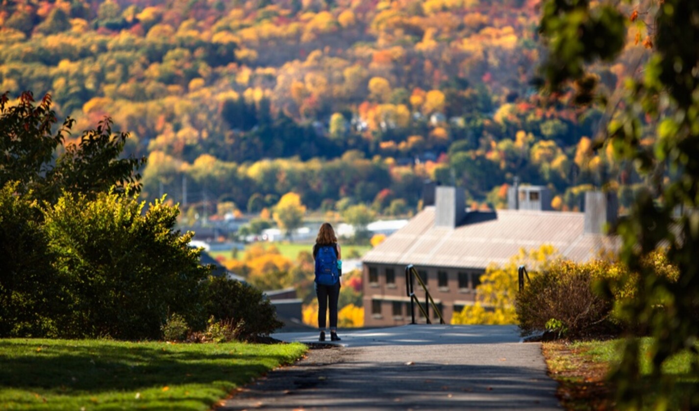 student on campus in fall