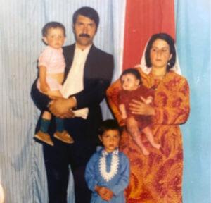 Farid (in blue) with his family in 1988