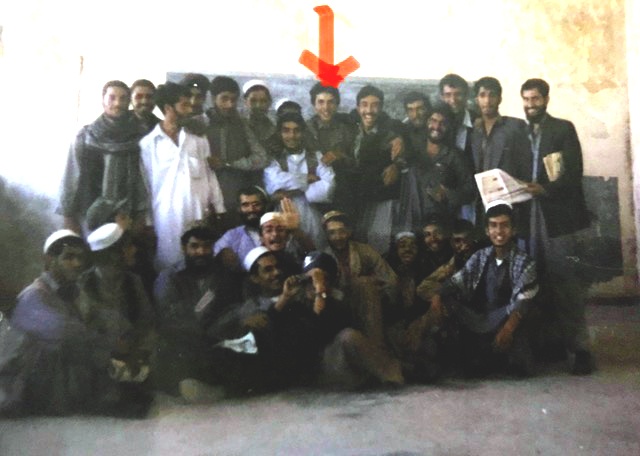 Farid (below red arrow) with his high school class in 1999