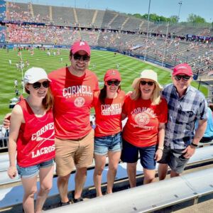 Julia (far left) and her family supporting Cornell lacrosse at the 2022 NCAA championships in Hartford, Connecticut
